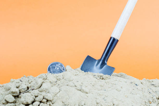 istock on a pile of sand a shovel and a ruble 1250242011