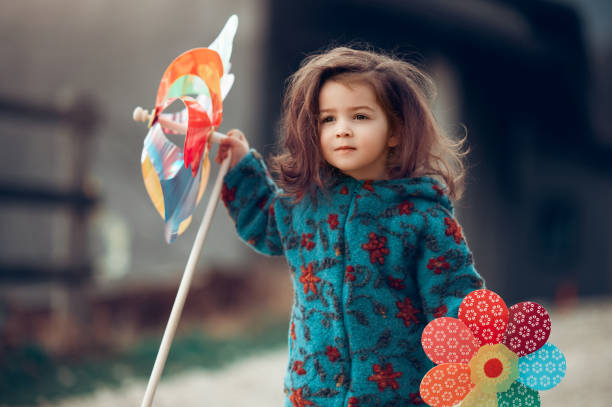istock Playing with my pinwheel outdoors 1250242663