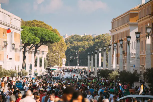 Photo of Vatican, Italy. Crowd Of People Tourists In The St. Peter's Square