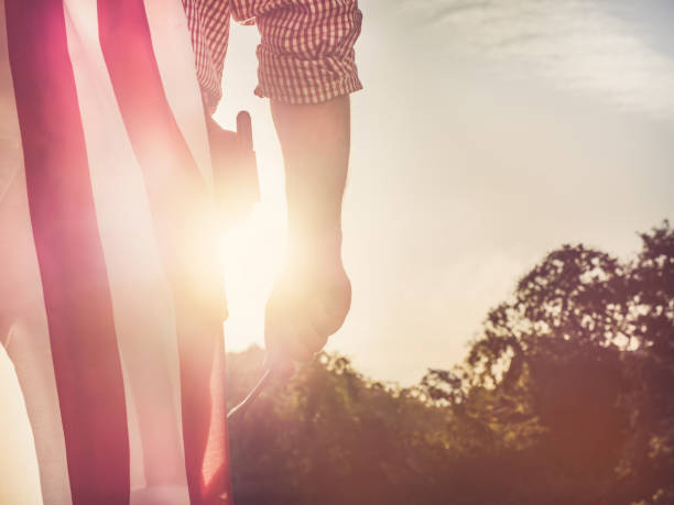 istock Young engineer, white hardhat and American Flag 1250244088