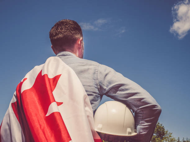istock Young engineer, white hardhat and Canadian Flag 1250244161