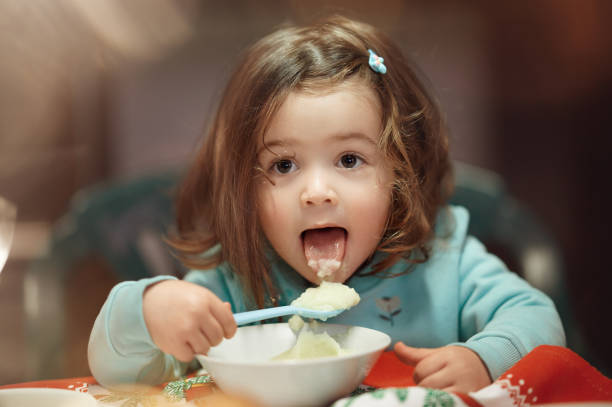 istock Sticking out tongue to eat mashed potatoes 1250244931