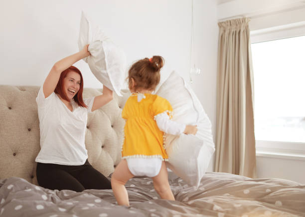 istock Bedroom pillow fight time 1250245012