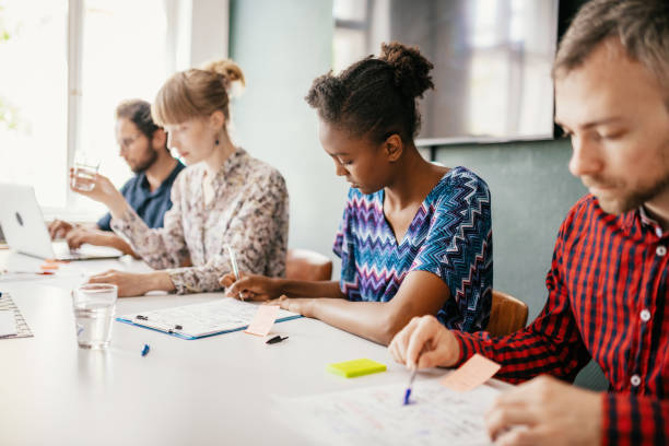 istock People working in modern office on international project 1250247106