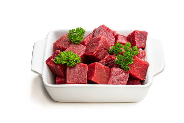 istock Sliced raw beef with parsley herb isolated on white 1250250495