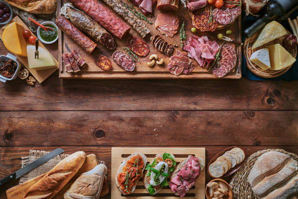 istock Tapas of cured ham and cheese delicious appetizer on rustic wood table with copy space 1250251758