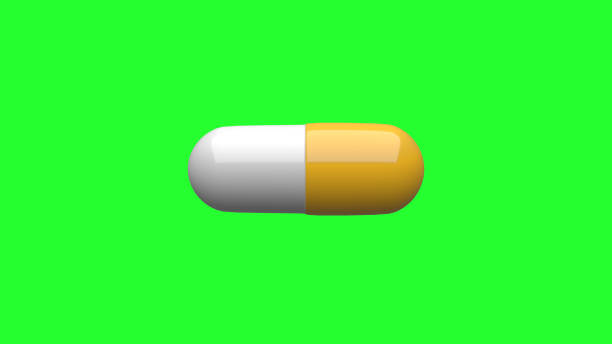 istock White-Yellow pills isolated. Green Screen. 4K UHD. 3d rendering. 1250253330
