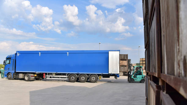 istock loading a truck with a forklift truck in a company 1250254264