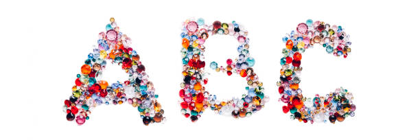 Letters A, B, C made from beautiful glass bright gems or crystals on isolated white background, banner size