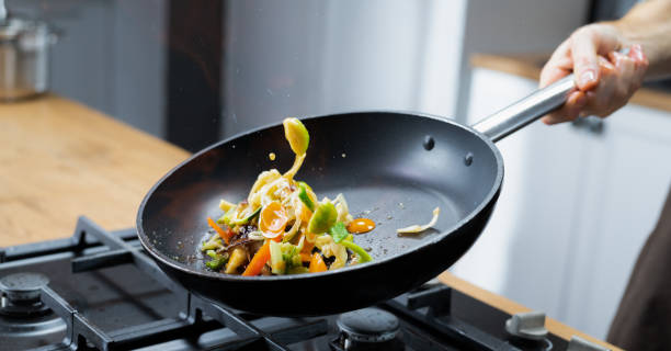 istock Professional Chef Tossing Food 1250259637