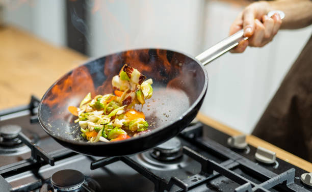 istock Professional Chef Tossing Food 1250259638