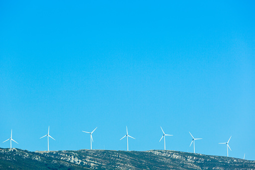 Mountainside with a windmills in the Mediterranean in Tarifa, AL, Spain