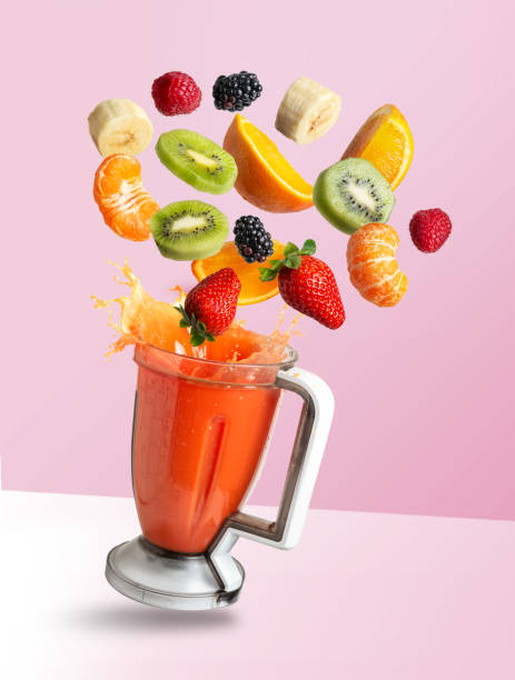 istock Smoothie mixer with drink and fruit flying ingredients, isolated on pink background 1250266330