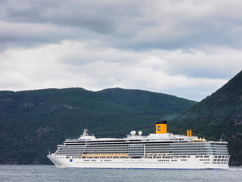 Cruise ship Costa Luminosa sailing in the Aurlandsfjord in Norway during a summer day. The Aurlandsfjord is a branch off of the main Sognefjorden, Norway's longest fjord and together with the connected Naeroyfjord one of the most popular tourist attractions in Norway.