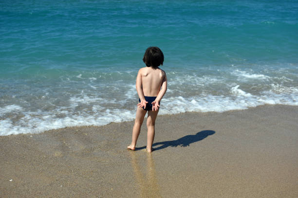 istock Little boy enjoying on beach 1250268082