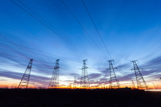istock pylon, In the evening, the high voltage tower and the beautiful sunset glow 1250268532