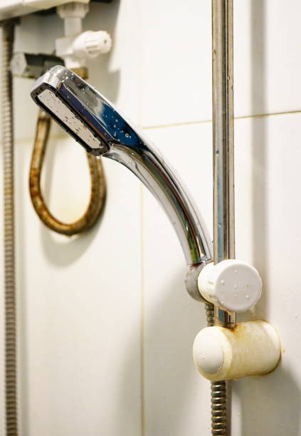 istock Shower head sprinkling water and Water heater 1250269061