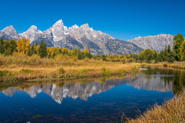 istock Grand Teton Range with beautiful reflection of snow capped mountains. 1250269778
