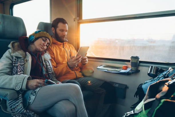istock Couple traveling by train 1250270562