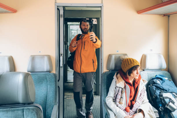 istock Tourist traveling by train is vlogging 1250270806