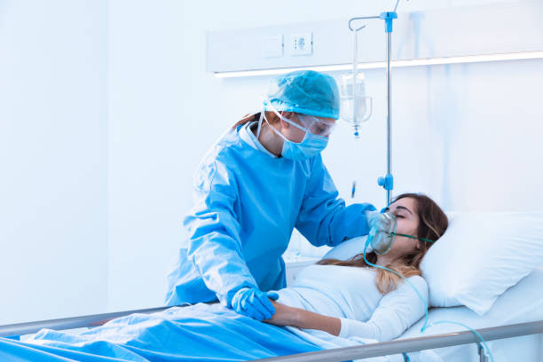 Nurse comforting a sick patient in the ward stock photo