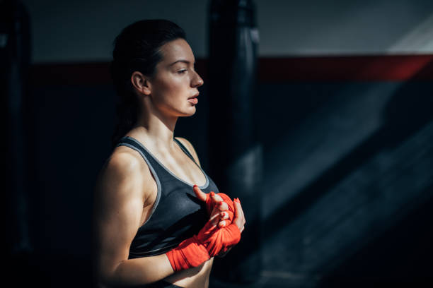 istock Young female kickboxer in the gym 1250272832