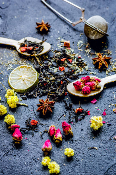 istock Spoons with herbs on dark background 1250273037