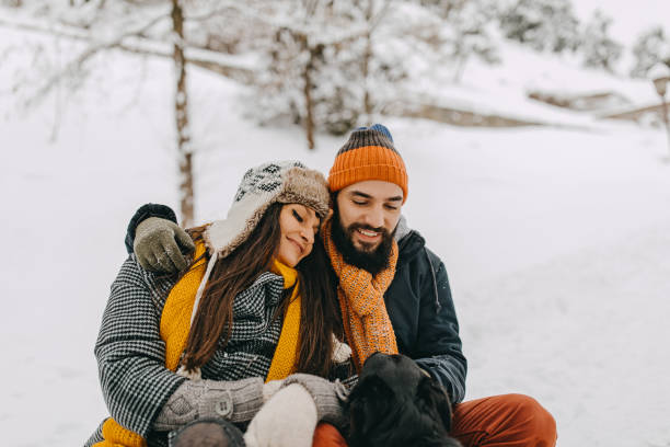 istock Couple in the snow playing 1250274989