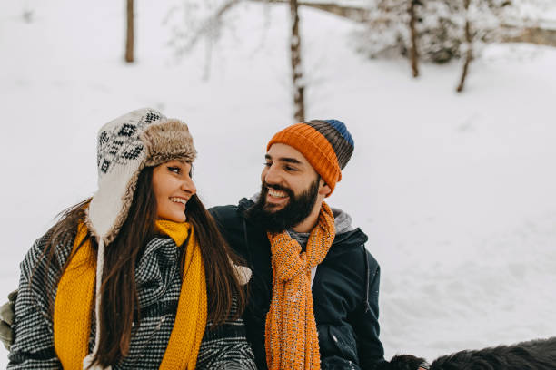 istock Couple in the snow playing 1250274992