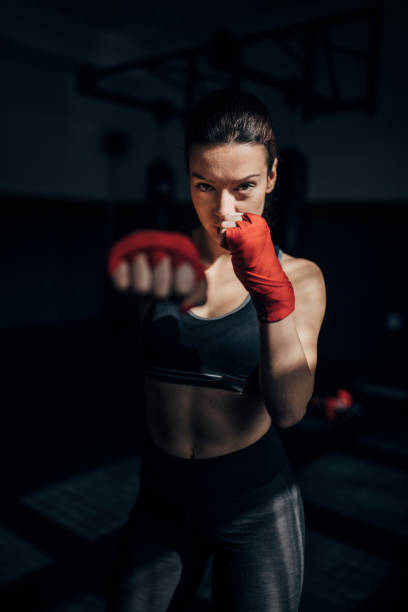 istock Female kickboxer exercising 1250274993