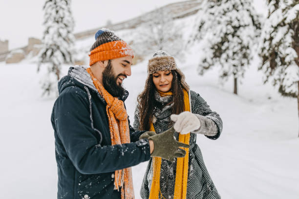 istock Couple in the snow playing 1250275002