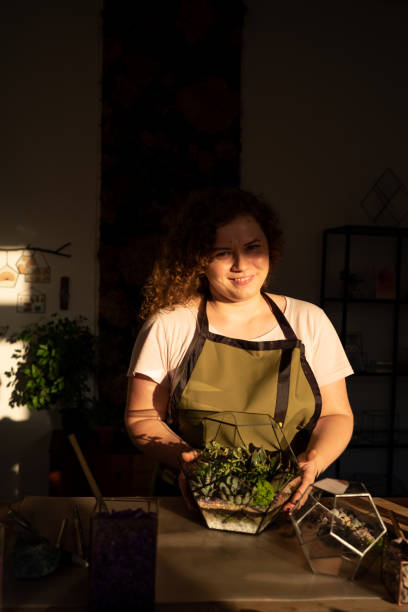 istock Girl Making Florarium in sunlight 1250275940