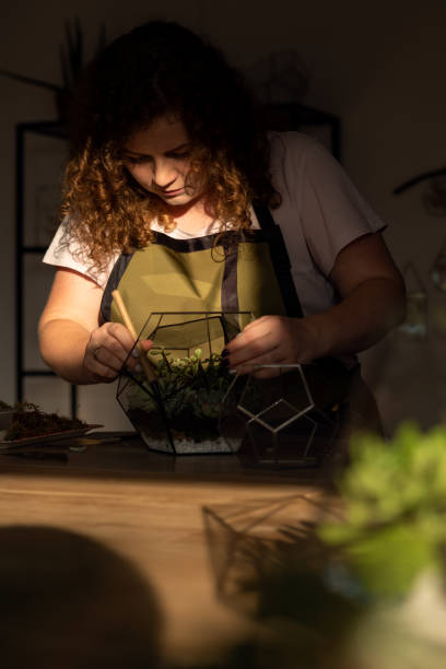 istock Girl Making Florarium in sunlight 1250276525