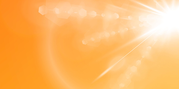 Abstract sparkling lens flare with sparkling sun on a yellow and orange background. A warm sun that is filled with natural rays of light glare. Isolated vector illustration.