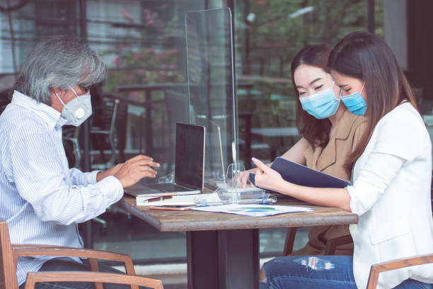 istock Group of people wearing masks and working together 1250277372
