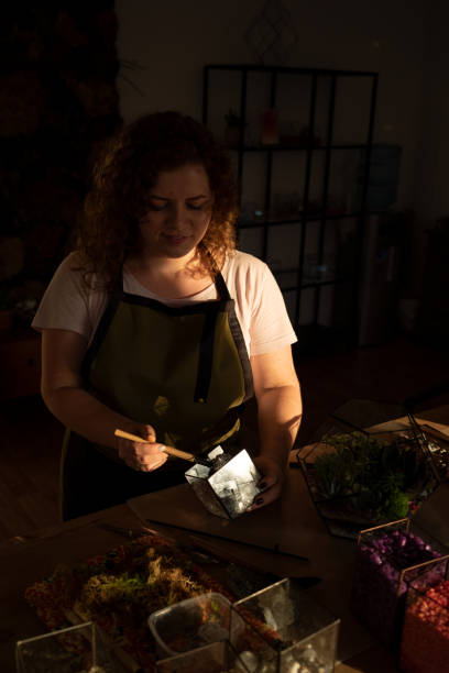 istock Girl Making Florarium in sunlight 1250277397