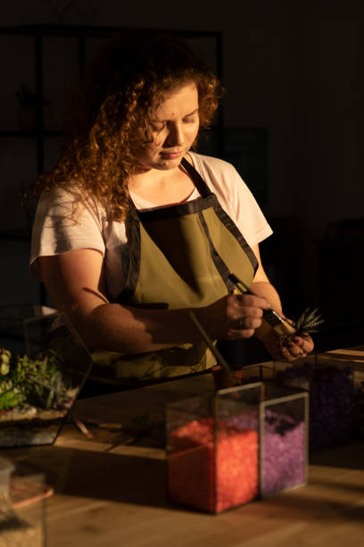istock Girl Making Florarium in sunlight 1250277557