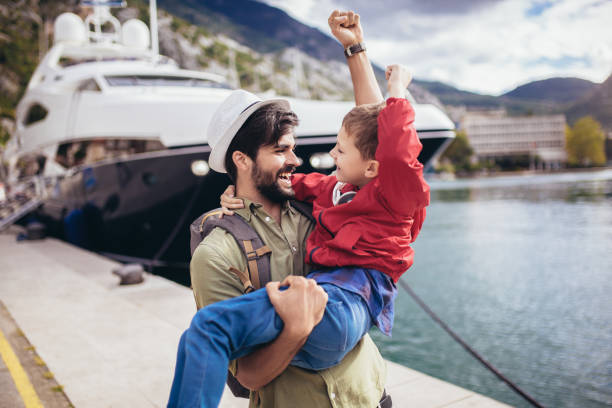 istock Happy father hugging little son arriving returning after long trip 1250277778