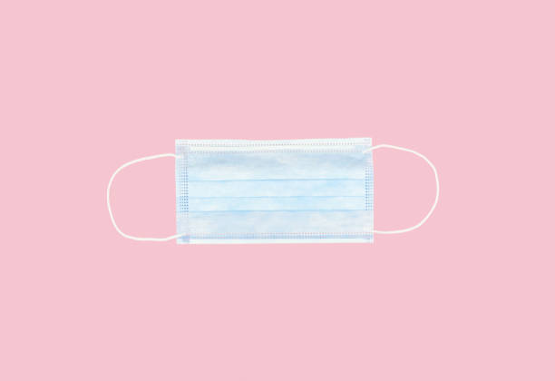 istock medical face mask isolated on pink background 1250278010