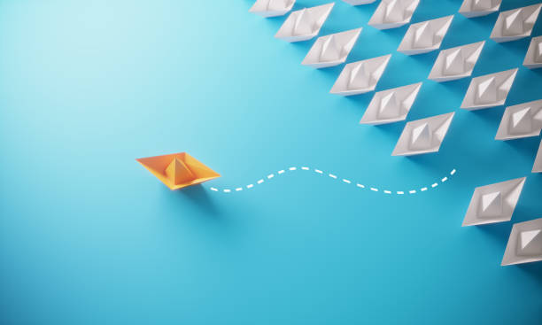 istock Leadership Concept With Paper Boats 1250279306
