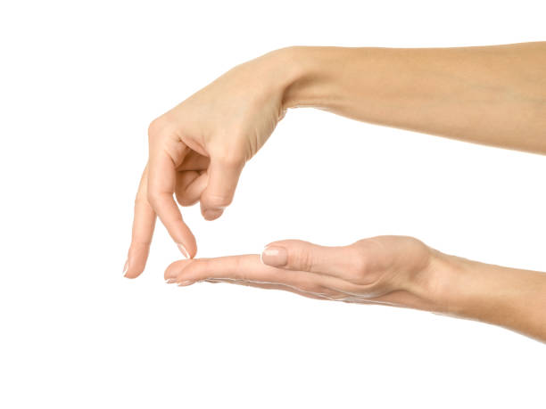mão de mulher com manicure francesa gesticulando isolada em fundo branco. parte da série - cliff finance risk uncertainty - fotografias e filmes do acervo