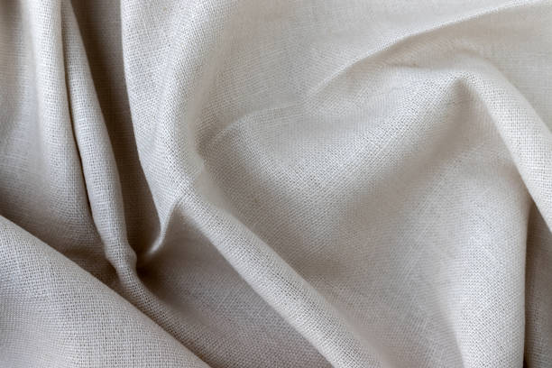 istock Natural linen fabric texture. Rough crumpled burlap background. Selective focus. Closeup view 1250279492