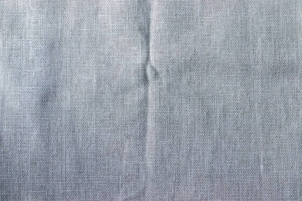 istock Natural linen fabric texture. Rough crumpled burlap background 1250279546
