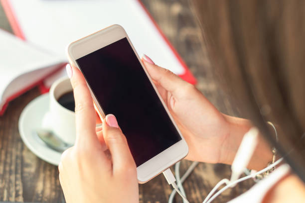 istock Woman hands holding smartphone. 1250279838