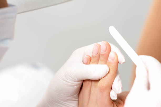 istock Manicure procedure by nail file. 1250280040