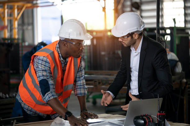 istock Multi-ethnic workers talking in metal fabrication plant 1250283105