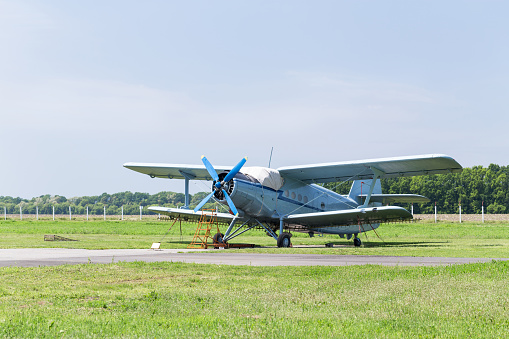 Antonov AN-2 aircraft is parked at the airfield for small aircraft.