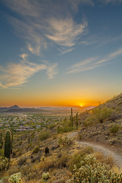 istock A desert trail on a mountain leading to a sunset over a valley in Phoenix 1250284621