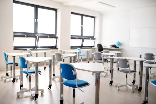 istock Desks in unconventional classoom in private school. 1250284934