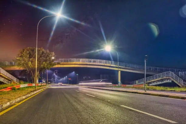 Photo of A bridge over the main road in the night